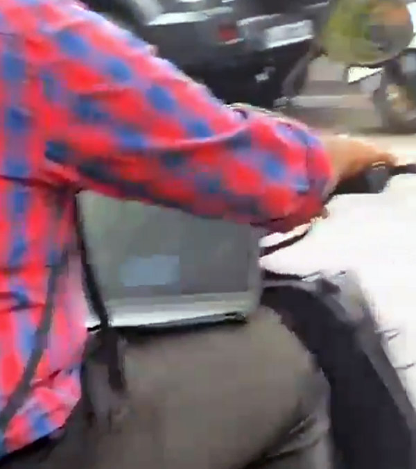 Bengaluru Video Viral Man Riding Scooter And Attends Office Video Conference In Laptop