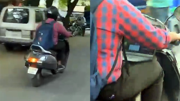 Bengaluru Video Viral Man Riding Scooter And Attends Office Video Conference In Laptop