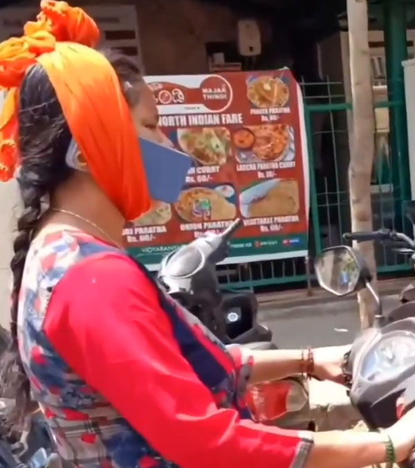 viral-video-bengaluru-woman-using-phone-while-riding-scooter