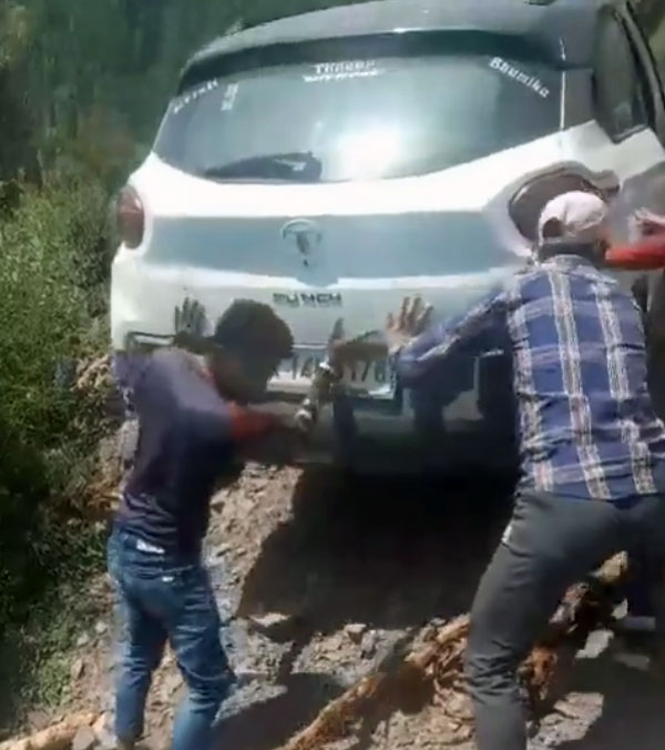 tata-punch-driver-jumped-out-after-car-falls-off-cliff