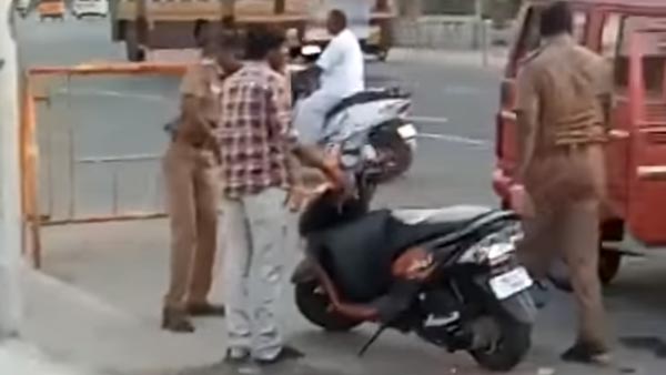 റോഡരികില്‍ നിര്‍ത്തിയിട്ട സ്‌കൂട്ടര്‍ തല്ലി തകര്‍ത്ത് പൊലീസ് — വീഡിയോ