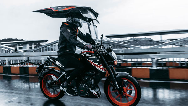 മഴയും വെയിലും ഏൽക്കേണ്ട; ഹിറ്റായി ഇരുചക്ര വാഹനങ്ങളിലെ പുത്തൻ ഷീൽഡ് സജ്ജീകരണം