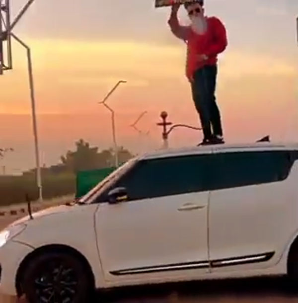 റീല്‍സിടാന്‍ എന്തും ചെയ്യും! വൈറലാകാന്‍ കാറിന് മുകളില്‍ ഹുക്ക വലിച്ച യുവാവ് എയറിലായി