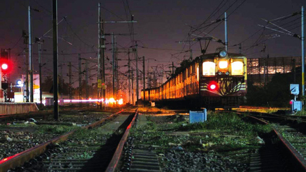 train arrives at night station