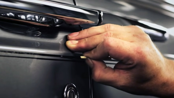 man who paints pinstripes on rolls royce