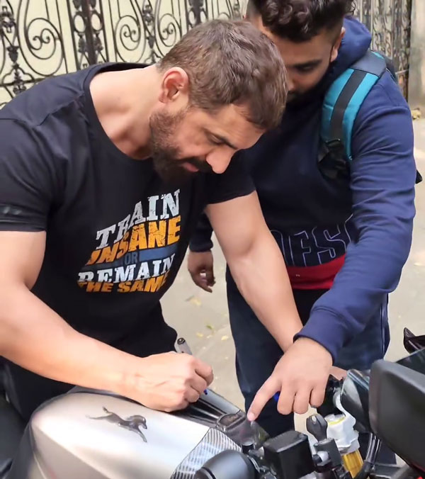 fan gets john abraham autograph on tvs apache