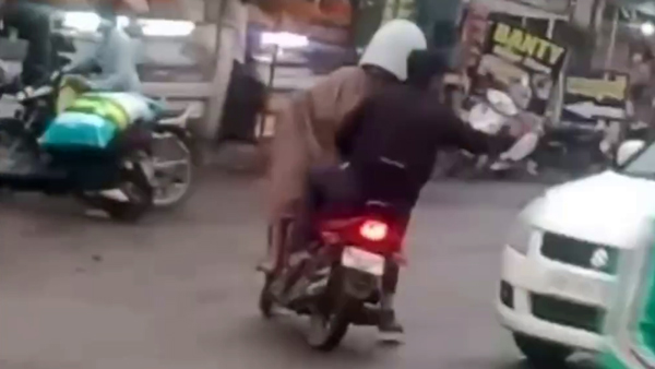 man wears water pipe to avoid challan