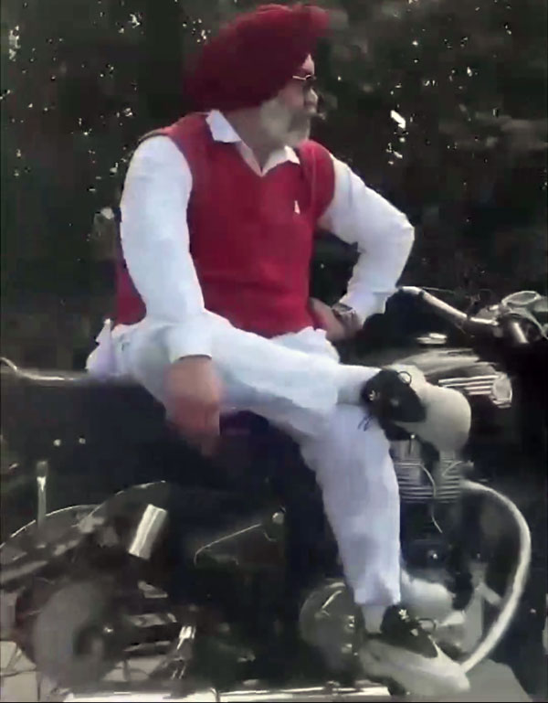 Elderly Man Riding Royal Enfield Bullet Without Using His Hands