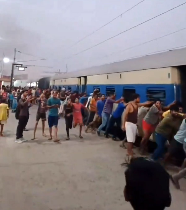 passengers pushing train coach