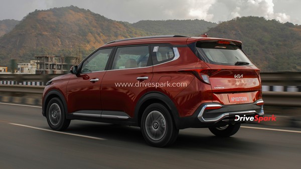 kia carens rear driving shot