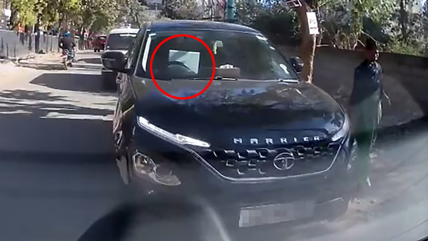 tata harrier driver using laptop while driving
