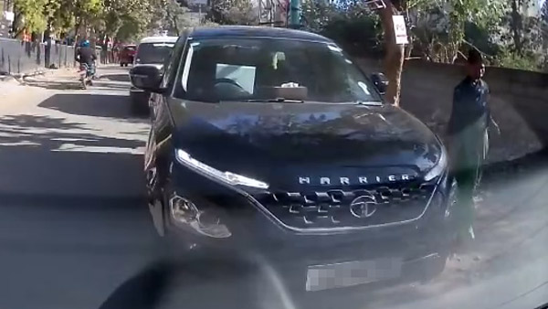 tata harrier driver using laptop while driving