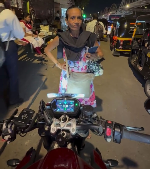 woman blocks triumph street triple rs rider