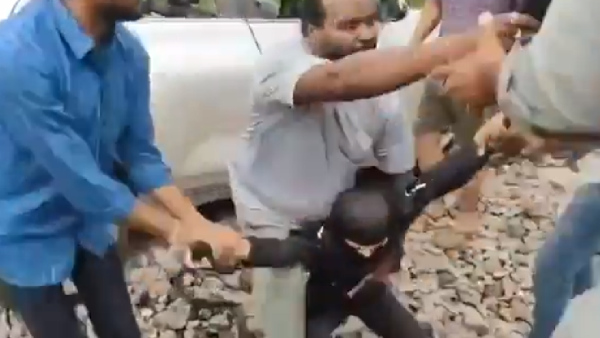 lady driver drove car on railway track