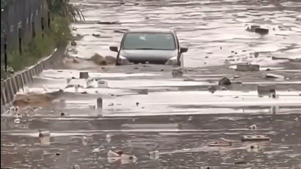 alto wading through flood roads