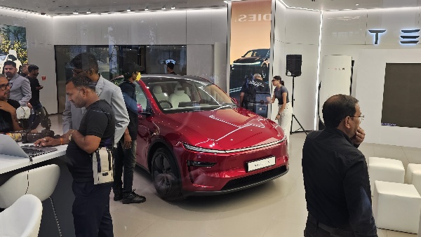 tesla model y red front quarter
