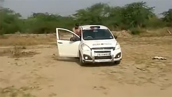 போலீஸ் காரில் நடந்த அதிர்ச்சி சம்பவம் இதுதான்... சமூக வலை தளங்களில் வைரலாகும் வீடியோ...