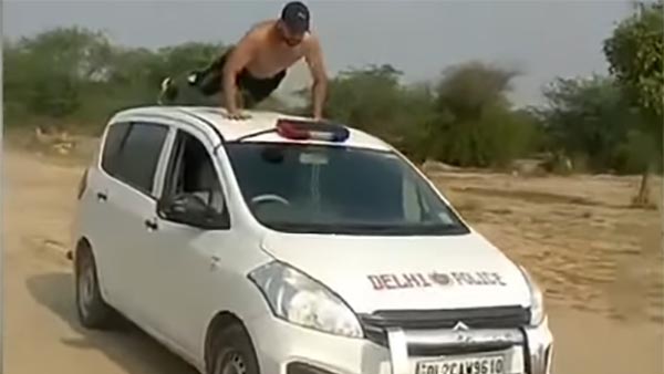 போலீஸ் காரில் நடந்த அதிர்ச்சி சம்பவம் இதுதான்... சமூக வலை தளங்களில் வைரலாகும் வீடியோ...