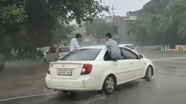 மழையில் நனைந்தபடி ஹாயாக பயணித்த இளைஞர்கள்... ரூ. 62 ஆயிரம் அபராத செல்லாணை வாரி வழங்கிய போலீஸ்!