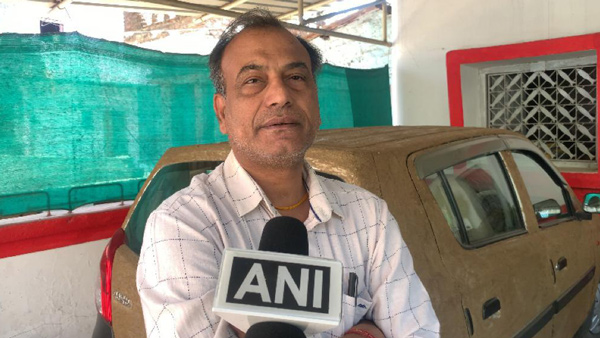 doctor coats his car with cow dung