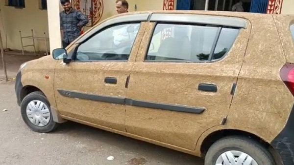 doctor coats his car with cow dung