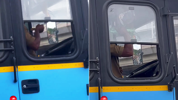 Bus Driver Finishes Lunch While Waiting In Traffic Jam