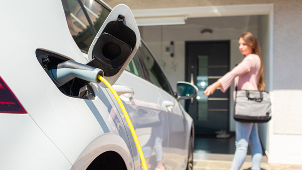 electric car owner tries fill petrol