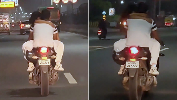 Lovers Cuddling On Moving Bike