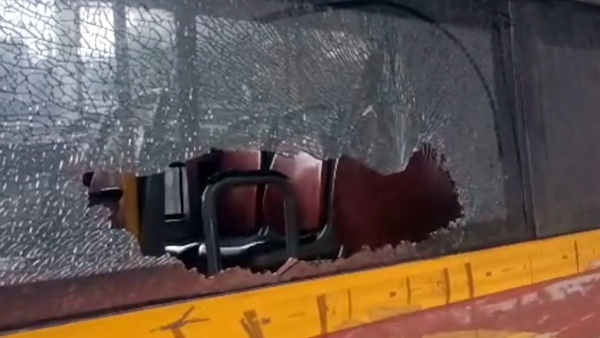 Woman Damages Government Bus By Throwing Stone