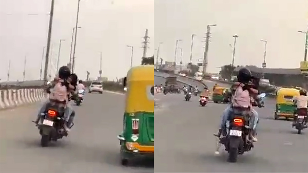 Couple romancing on speeding bike