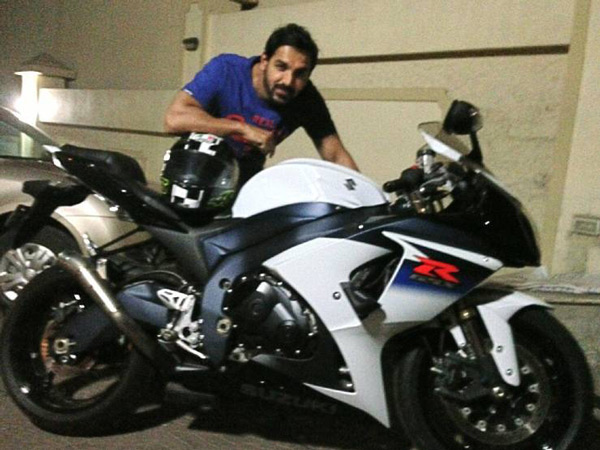 John abraham posing with his super bikes