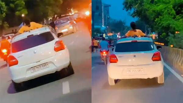 man lying on car bonnet