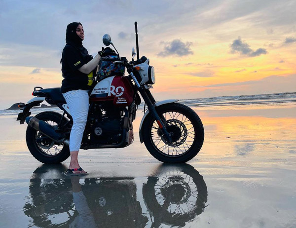Woman biker in beach