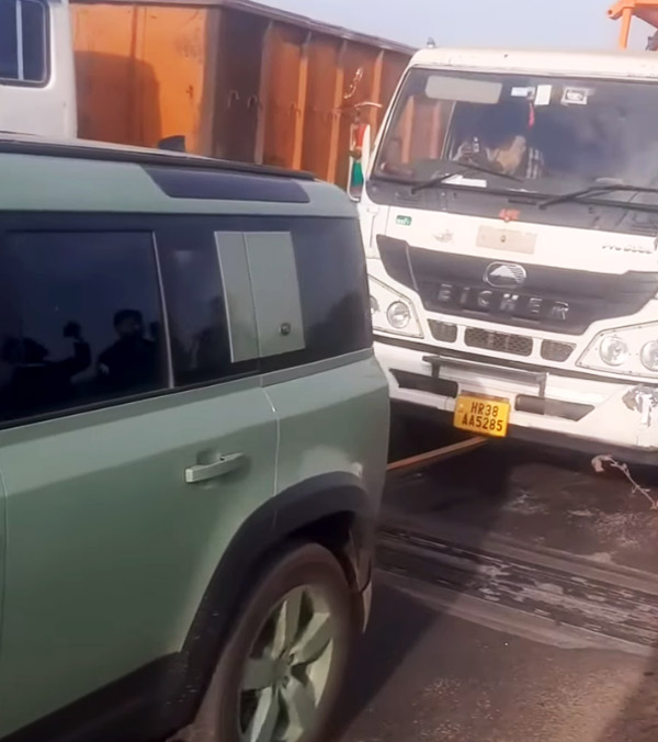 Luxury car defender tows lorry