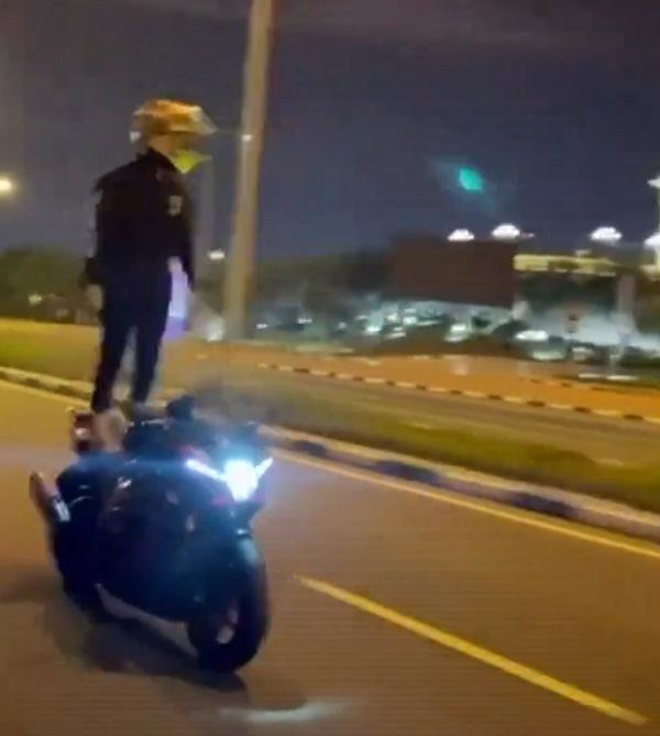 Motorcyclist performing stunts