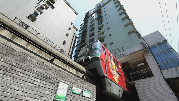 Metro trains run between 12 storey apartment
