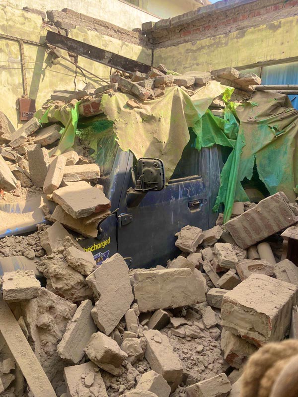 Car survives garage roof collapse