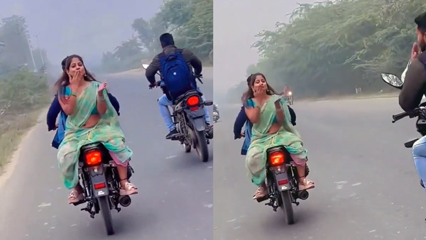 Woman creates reels on moving bike