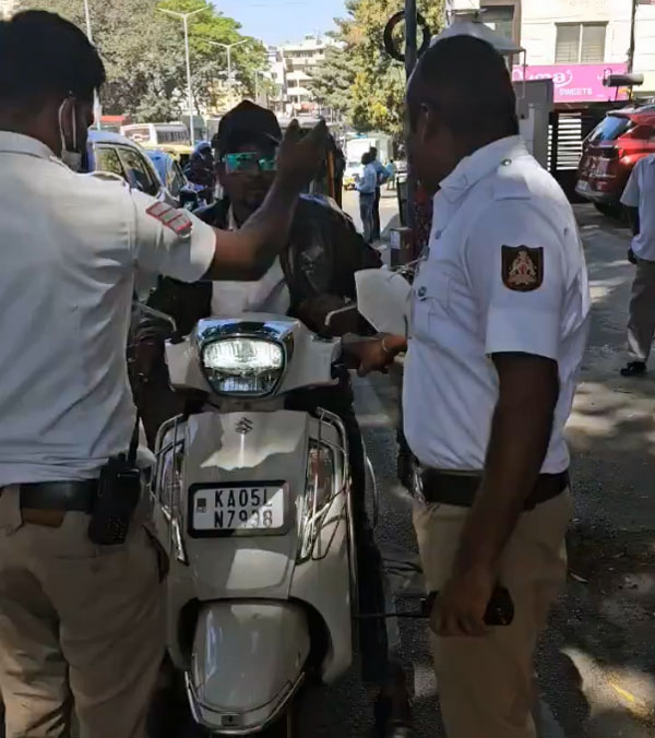 scooter rider bites traffic policeman