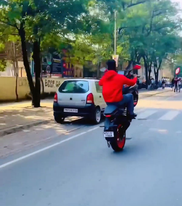 young man stunts on road young man stunts on road