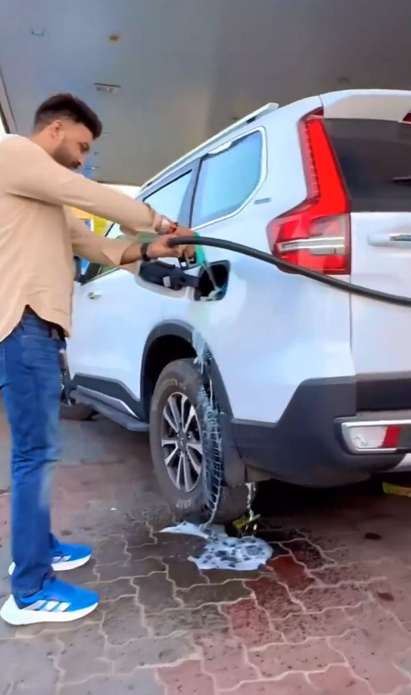 man overfills diesel in car