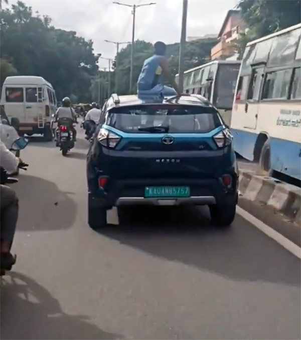 kid sit on moving car