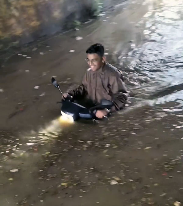 scooter ride in flooded roadways