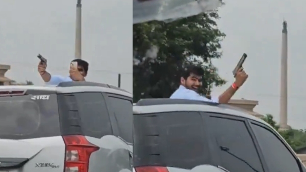 Dangerous stunt with gun on moving car