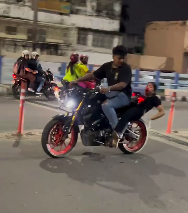girl stuck between tire and mudguard