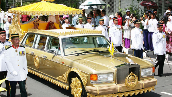 Gold wrapped rolls royce car