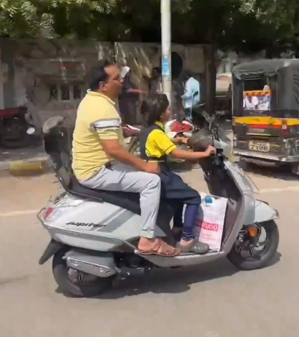 schoolgirl rides scooter on road schoolgirl rides scooter on road