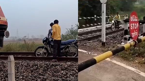 man rides bike towards train
