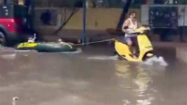 grandfather rides ola electric scooter