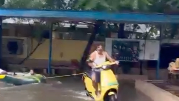 grandfather rides ola electric scooter